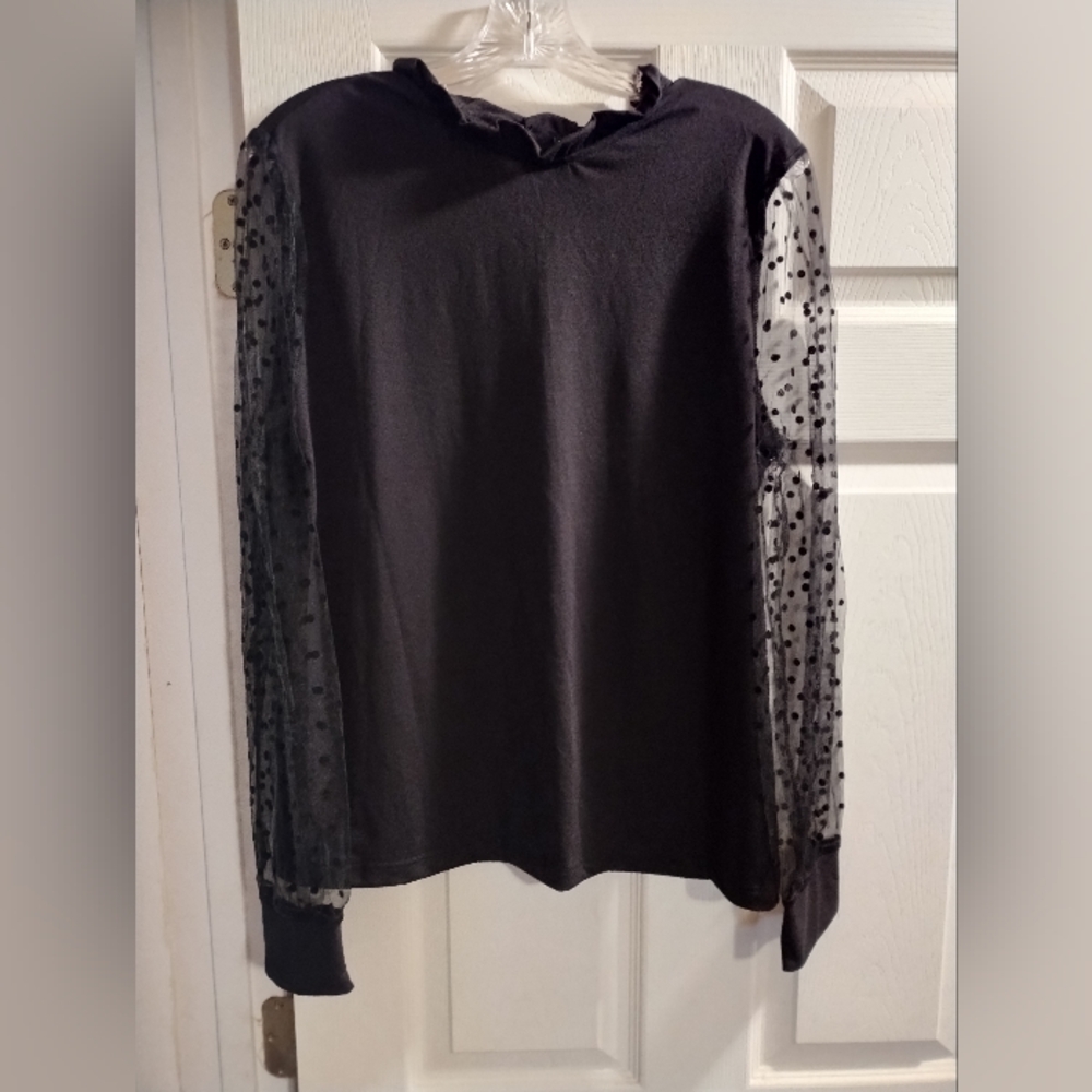 Elegant Black Top with Sheer Polka Dot Sleeves